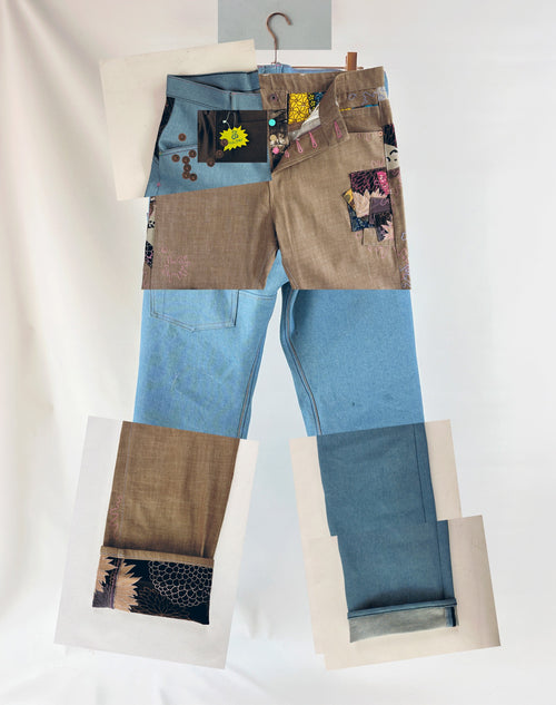 Holy Stitch! The Jean — hand-finished patchwork denim on a hanger, front view